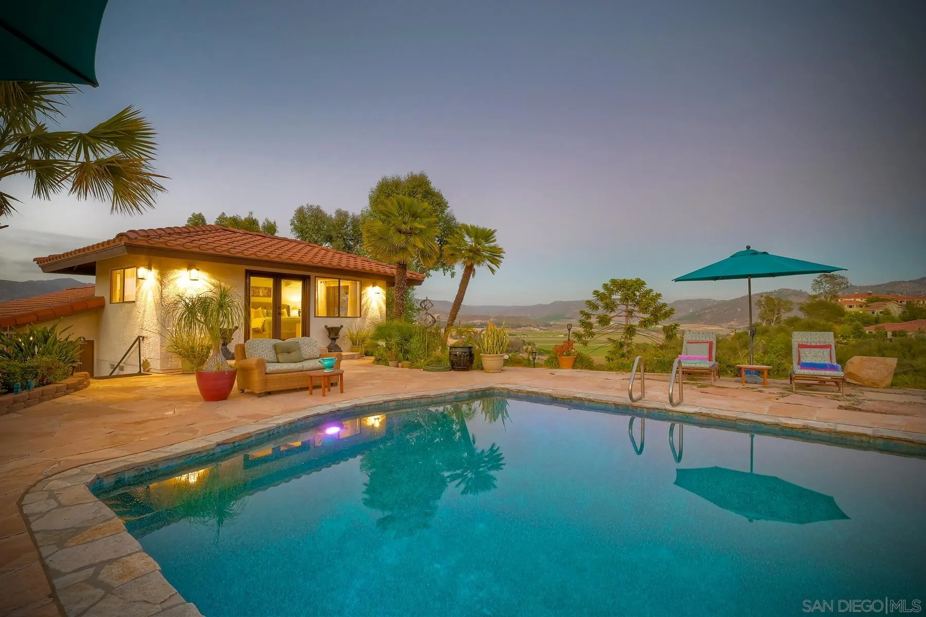 14102 Summit Crest Escondido, CA 92025 - Photo 49 of 52 a view of a swimming pool with lounge chairs