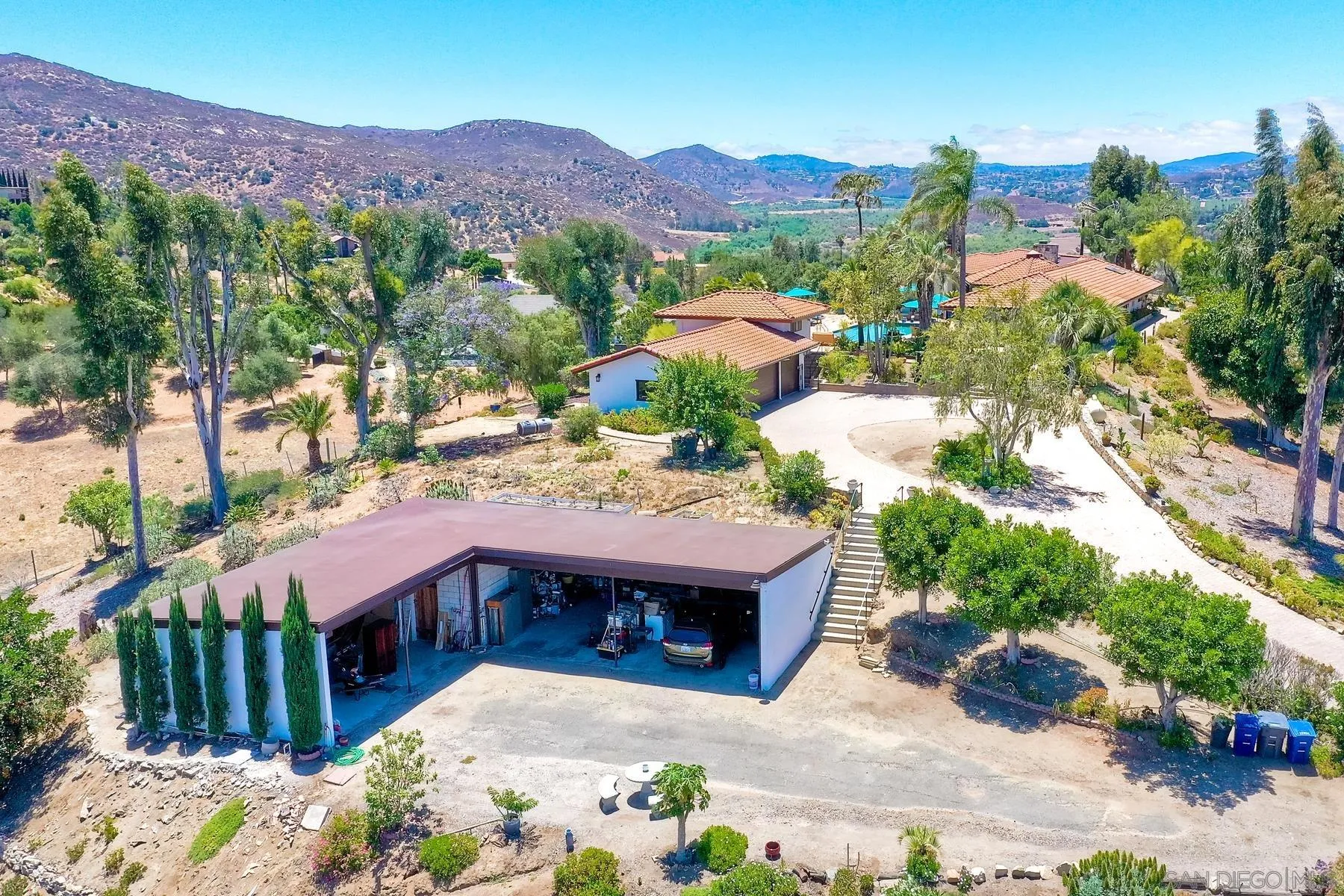 14102 Summit Crest Escondido, CA 92025 - Photo 8 of 52 a view of a houses with a yard