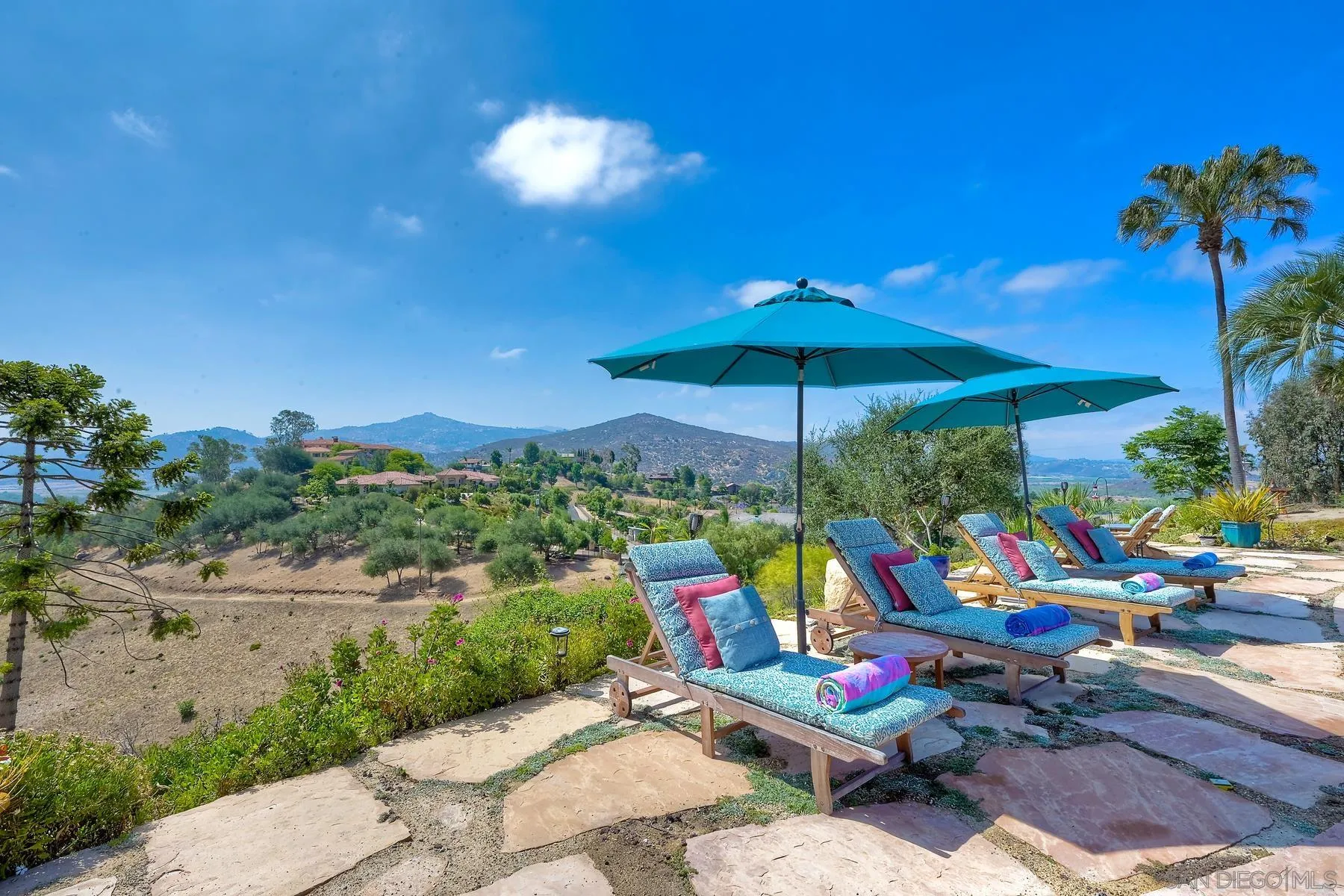 14102 Summit Crest Escondido, CA 92025 - Photo 10 of 52 a chair and tables in the patio
