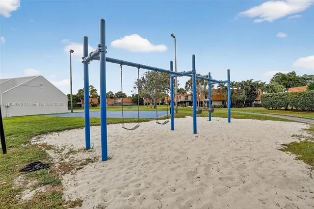 a view of a lake with a table and chairs