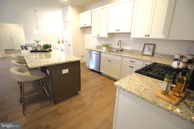 a bathroom with a sink toilet and a mirror
