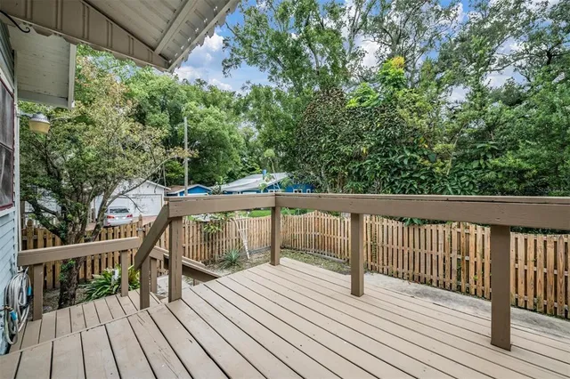 a view of deck with wooden floor and outdoor seating