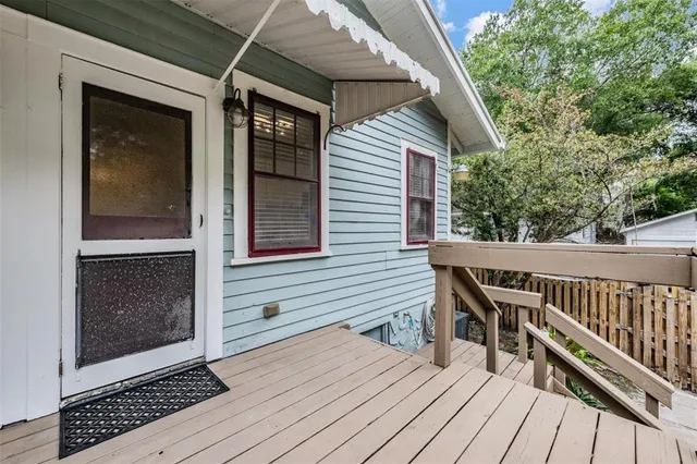a view of deck with wooden floor and chair