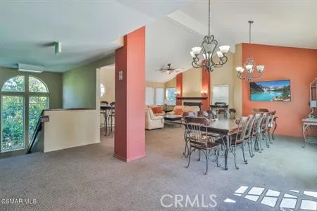 an aerial view of a pool patio outdoor seating and outdoor kitchen