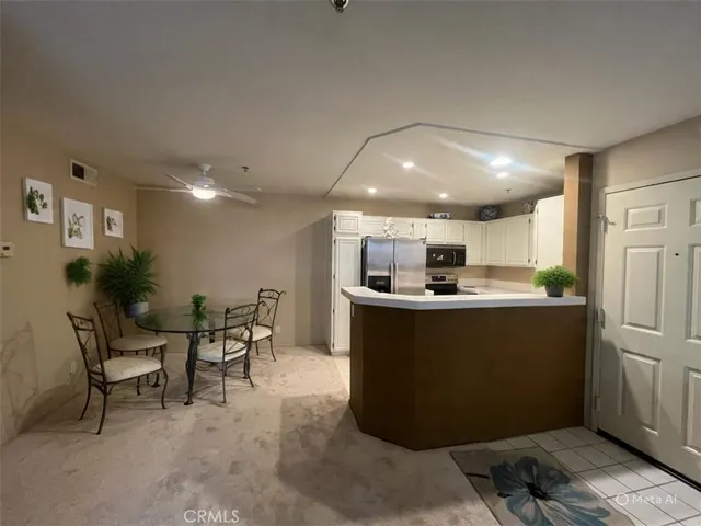 a street sign on a wall next to a road