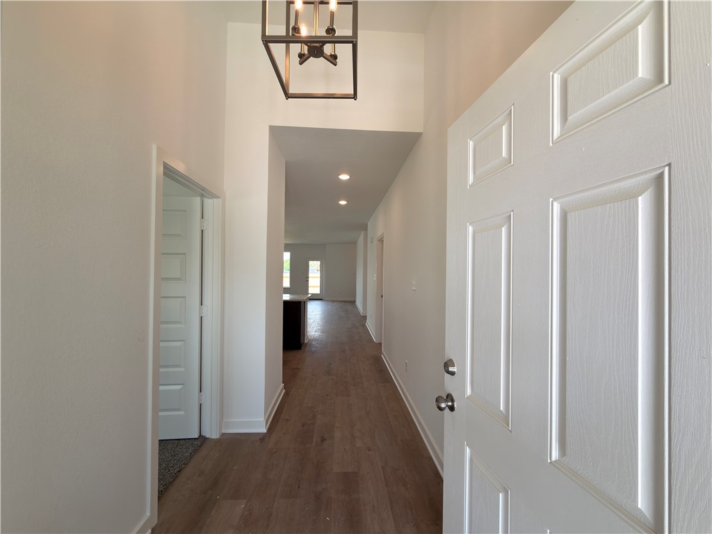 6053 Badger Street Bryan, TX 77807 - Photo 2 of 13 a view of a hallway with wooden floor and staircase