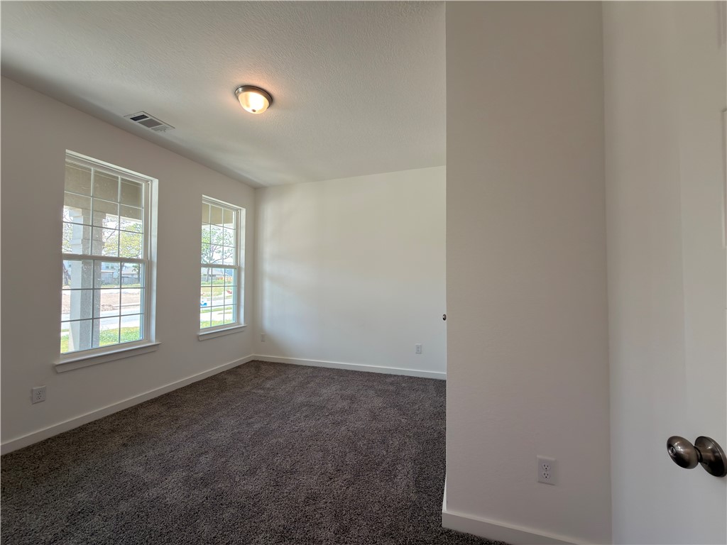 6053 Badger Street Bryan, TX 77807 - Photo 3 of 13 an empty room with a window