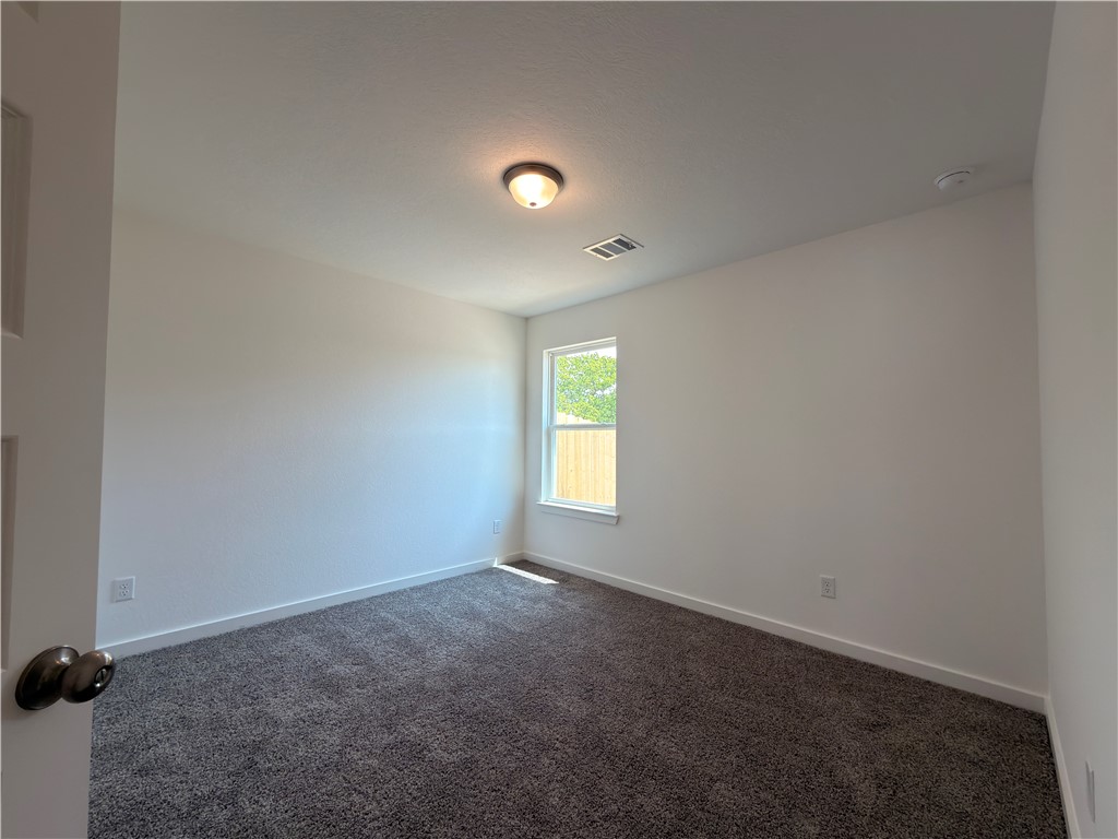 6053 Badger Street Bryan, TX 77807 - Photo 9 of 13 an empty room with a window