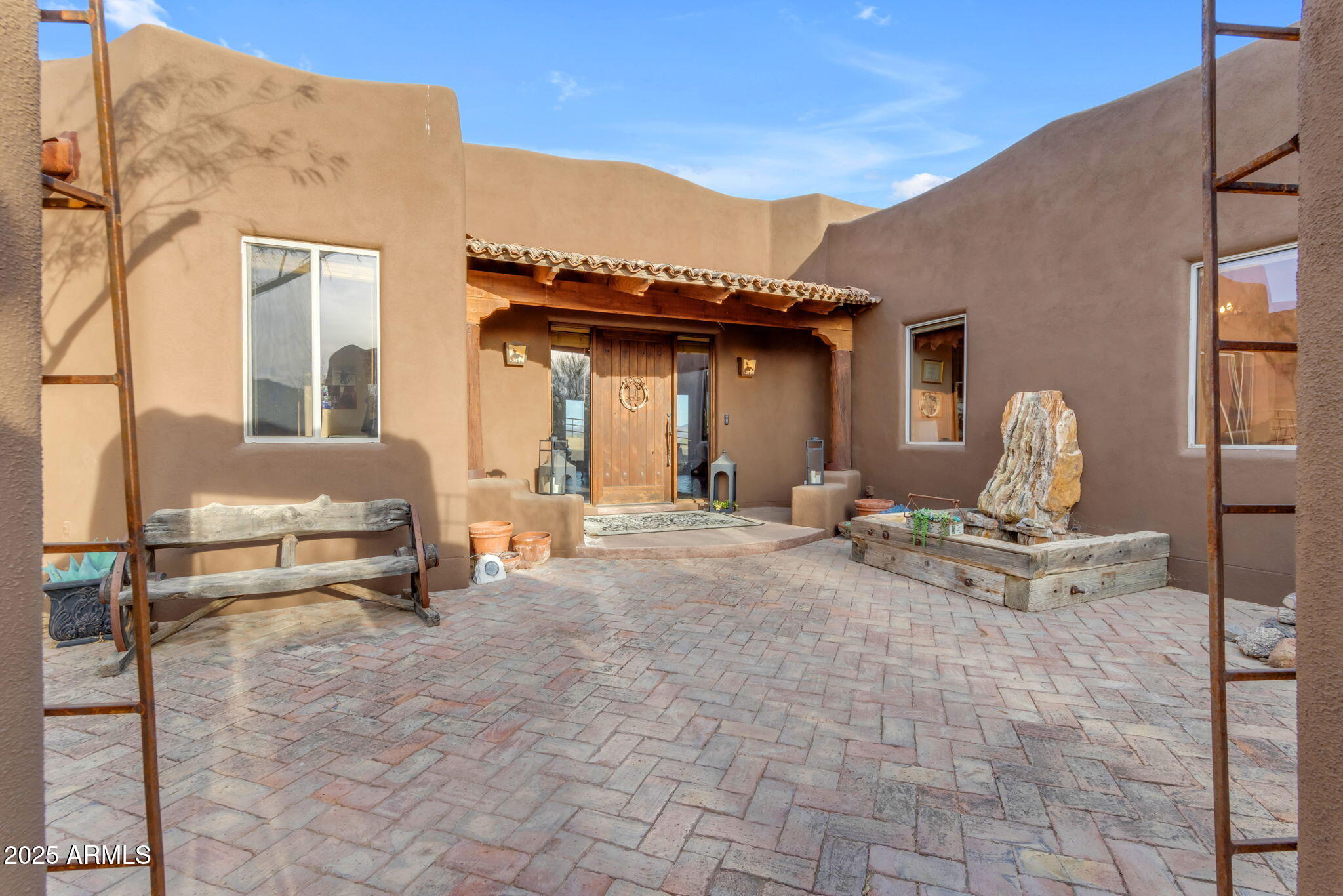 32905 North 140th Street Scottsdale, AZ 85262 - Photo 39 of 149 a view of a patio with a table and chairs and potted plants