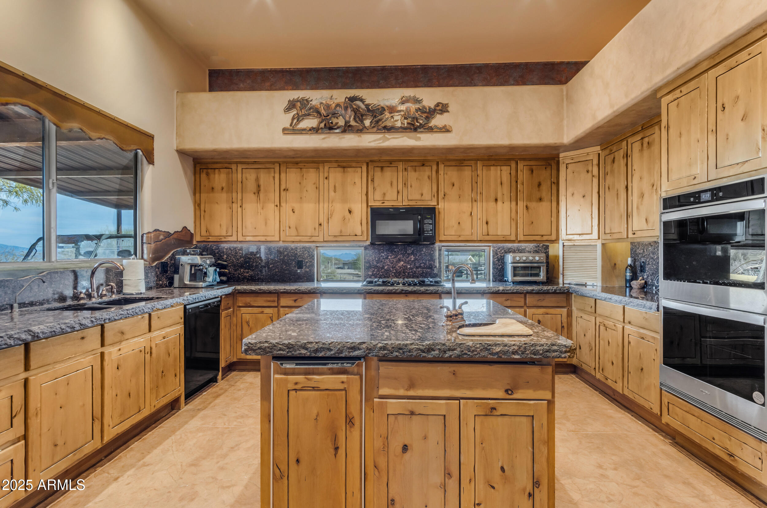 32905 North 140th Street Scottsdale, AZ 85262 - Photo 63 of 149 a kitchen with stainless steel appliances granite countertop a stove a sink and a granite counter tops