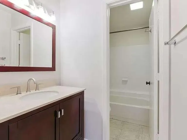 a bathroom with a sink and a mirror