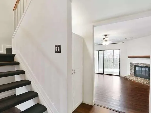 a view of an entryway with wooden floor