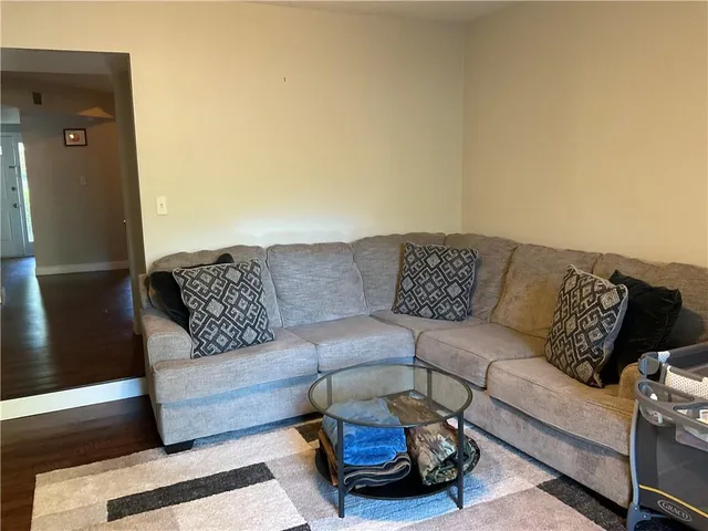 a living room with furniture and a couch