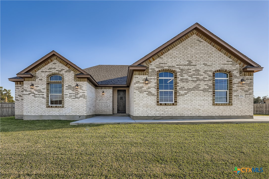 222 Arosa Drive Elgin, TX 78621 - Photo 15 of 40 a front view of a house with a yard