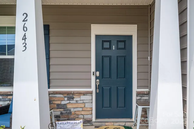 a dining room with furniture a window and a chandelier