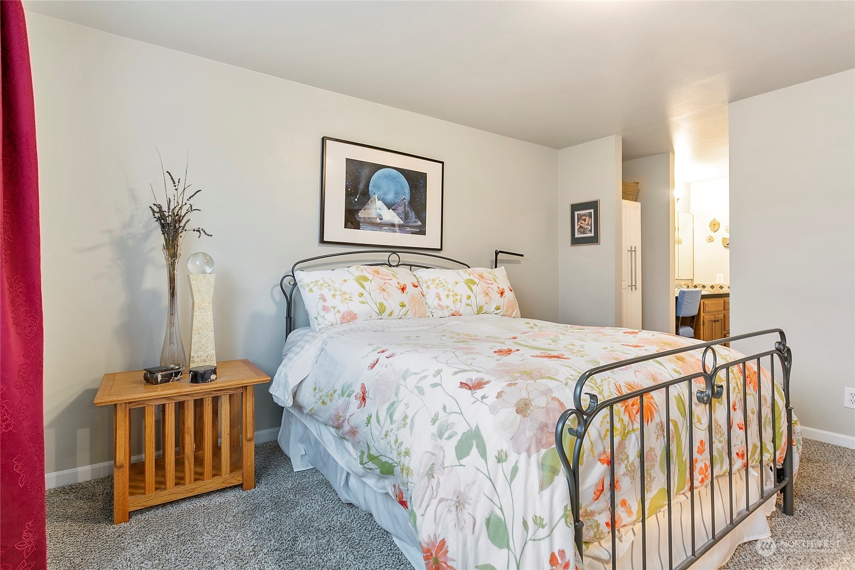 107 Fairside Drive, Unit 25 Lynden, WA 98264 - Photo 16 of 29 a bedroom with a bed and a chandelier