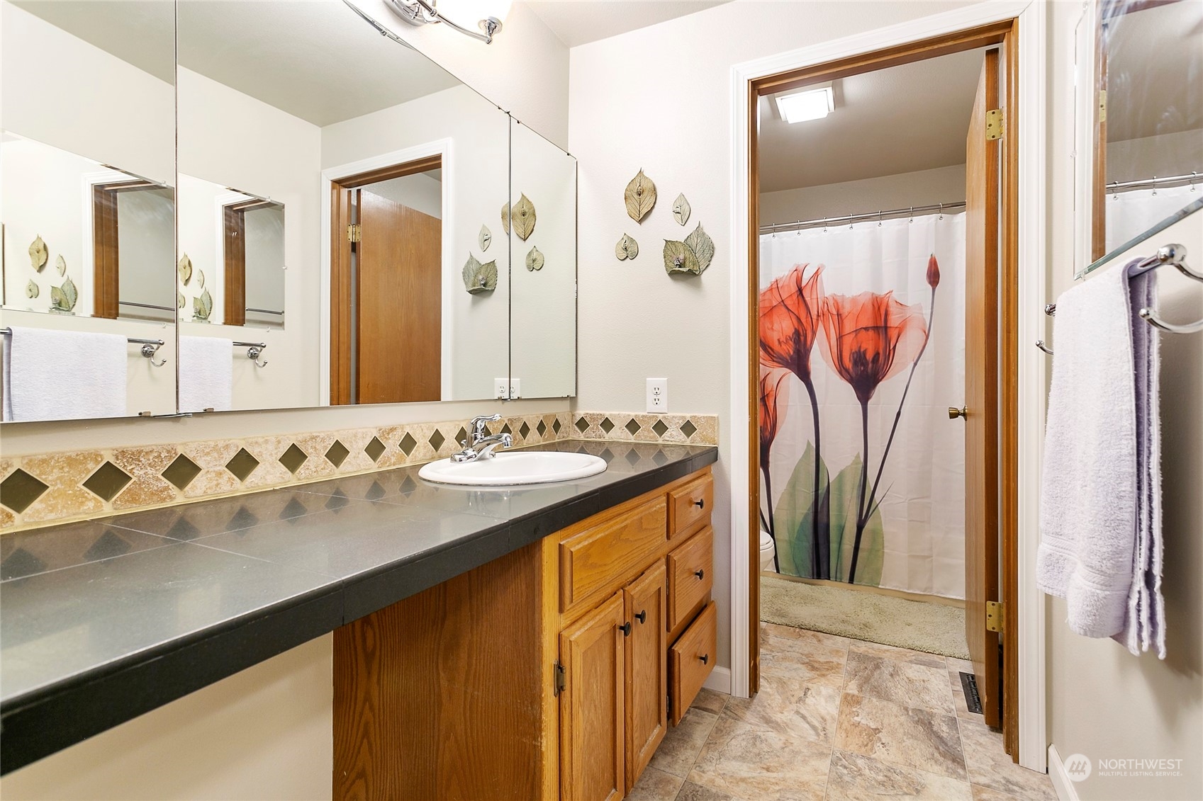 107 Fairside Drive, Unit 25 Lynden, WA 98264 - Photo 18 of 29 a bathroom with a sink and a mirror