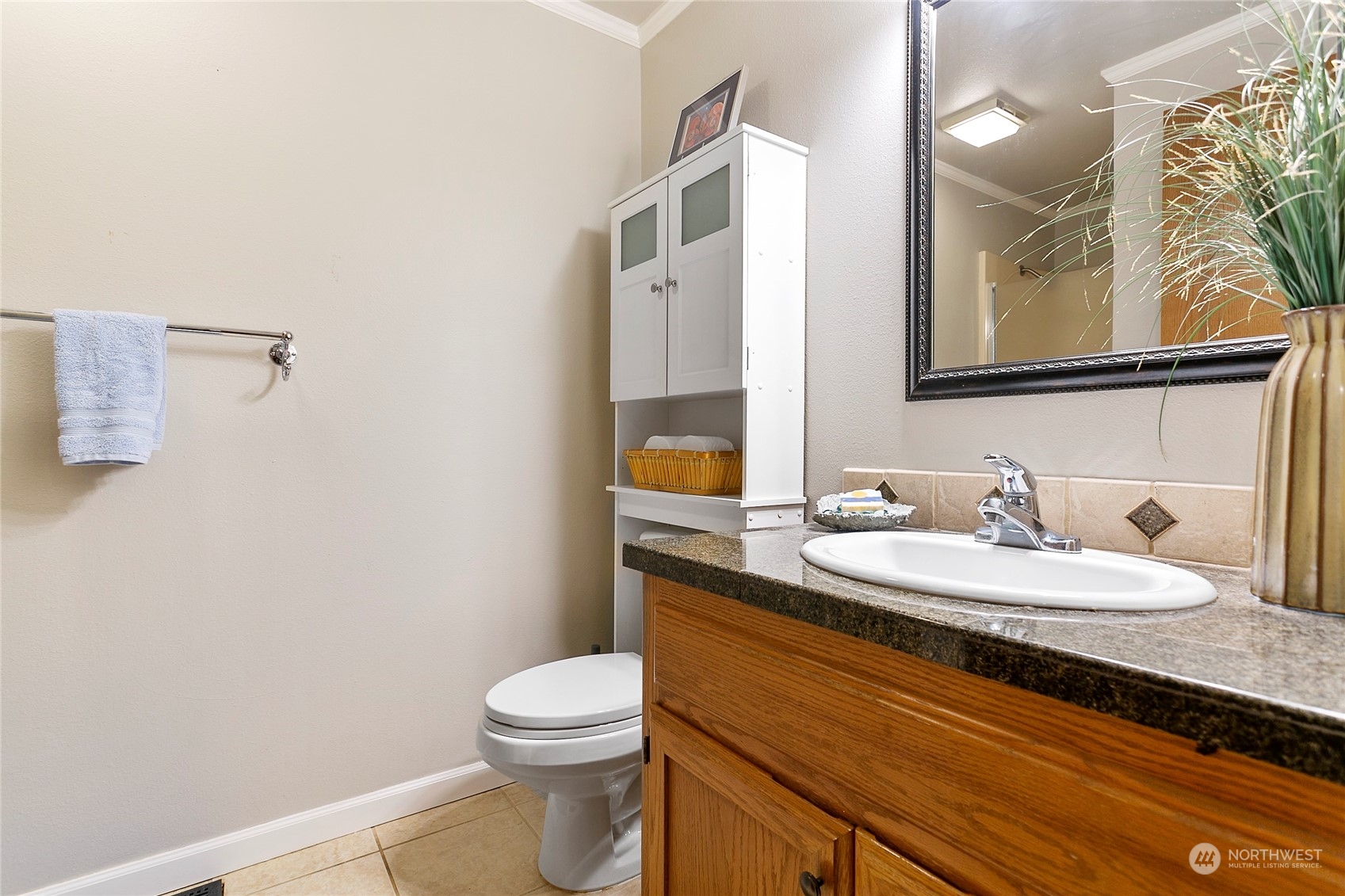 107 Fairside Drive, Unit 25 Lynden, WA 98264 - Photo 21 of 29 a bathroom with a granite countertop sink mirror vanity and toilet