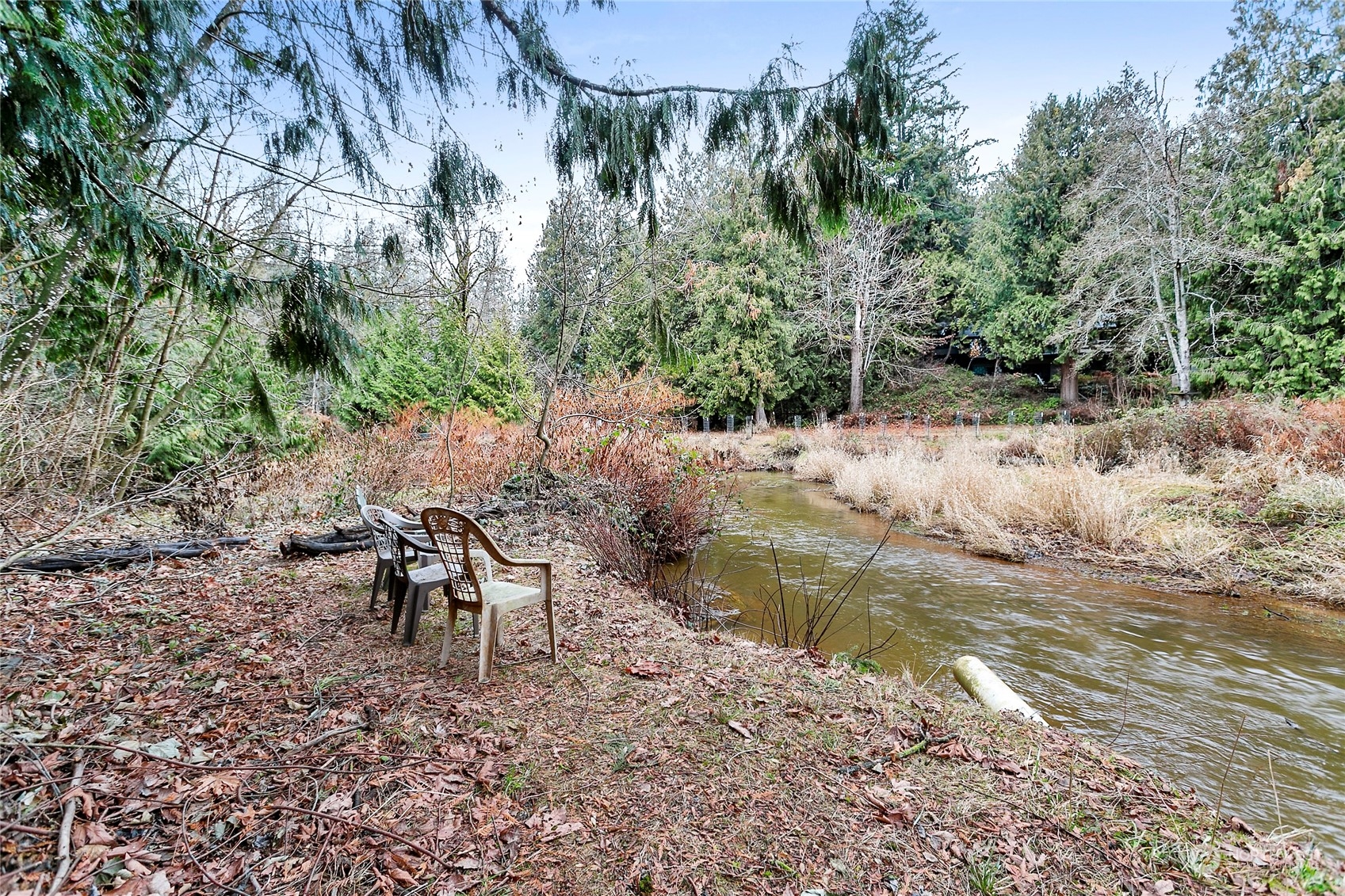 107 Fairside Drive, Unit 25 Lynden, WA 98264 - Photo 27 of 29 a view of a lake with outdoor seating