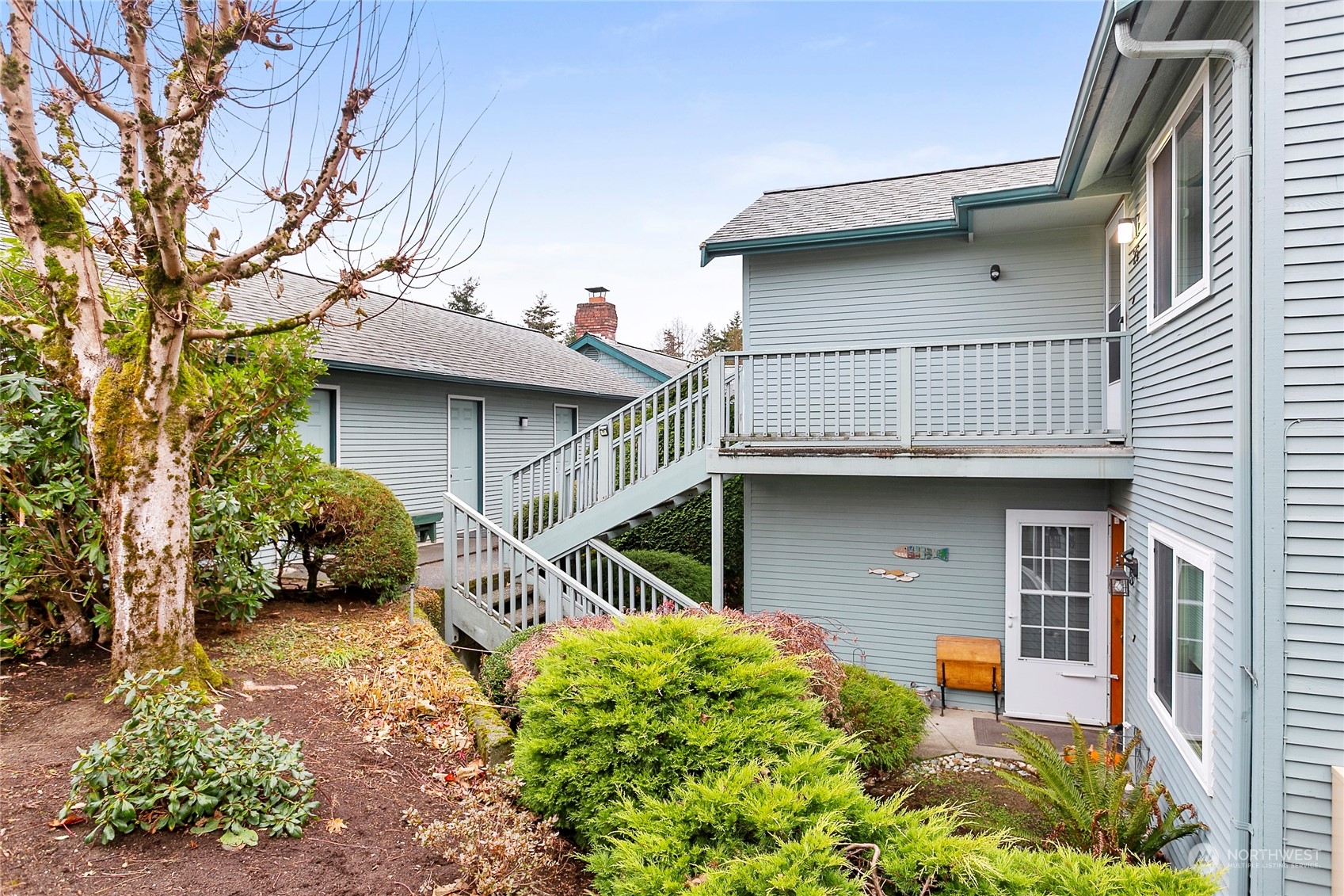 107 Fairside Drive, Unit 25 Lynden, WA 98264 - Photo 29 of 29 a house with trees in front of it