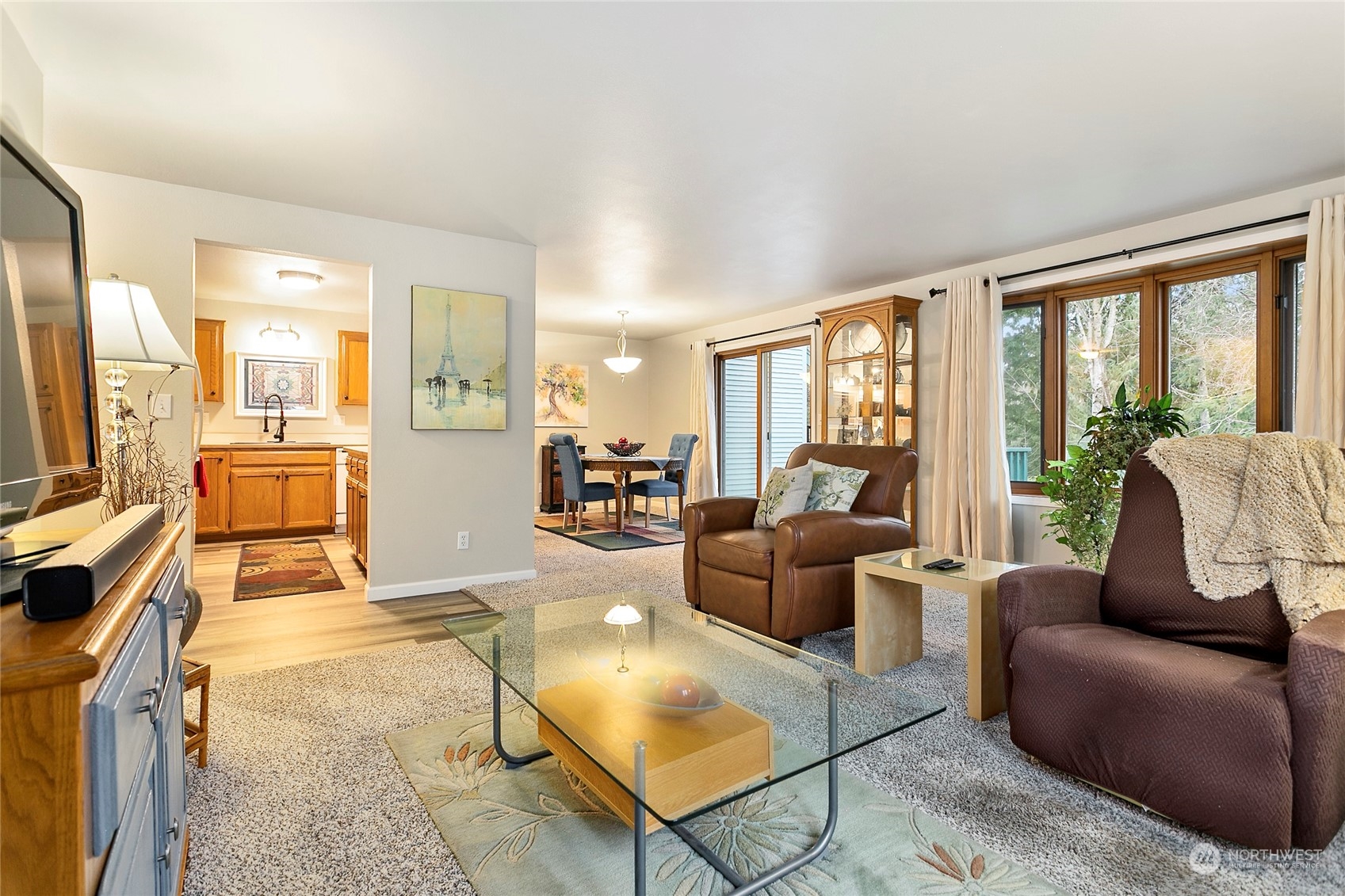107 Fairside Drive, Unit 25 Lynden, WA 98264 - Photo 6 of 29 a living room with furniture large windows and a flat screen tv