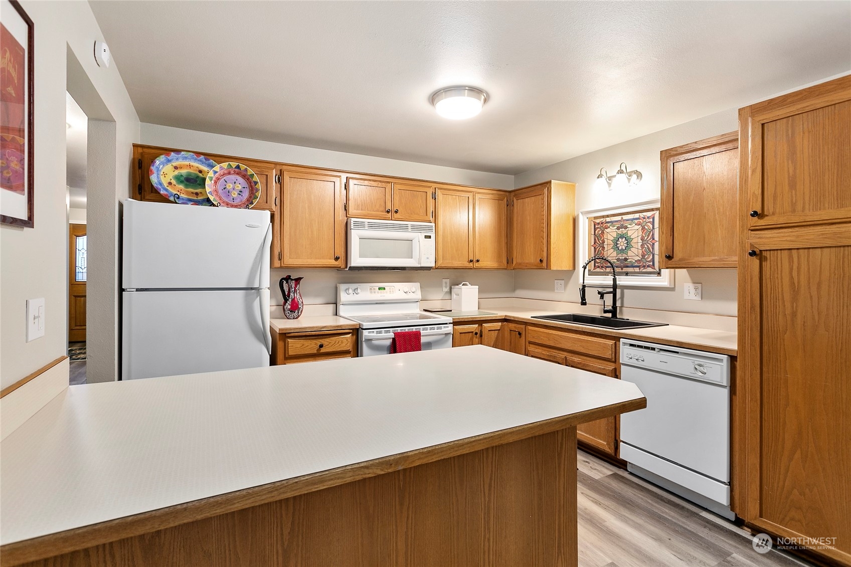 107 Fairside Drive, Unit 25 Lynden, WA 98264 - Photo 10 of 29 a kitchen with stainless steel appliances a refrigerator and a sink