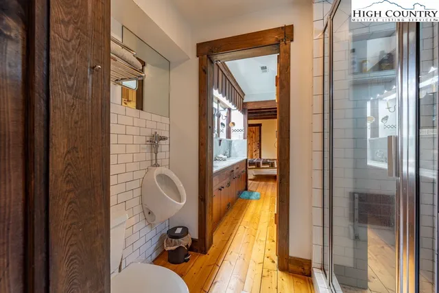 a bedroom with a bed and a table