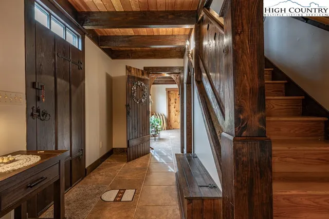 a view of a house with wooden floor and stairs