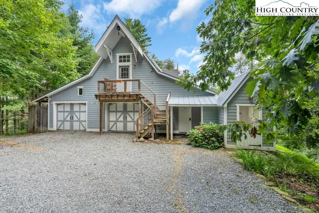 a view of a garden with wooden fence