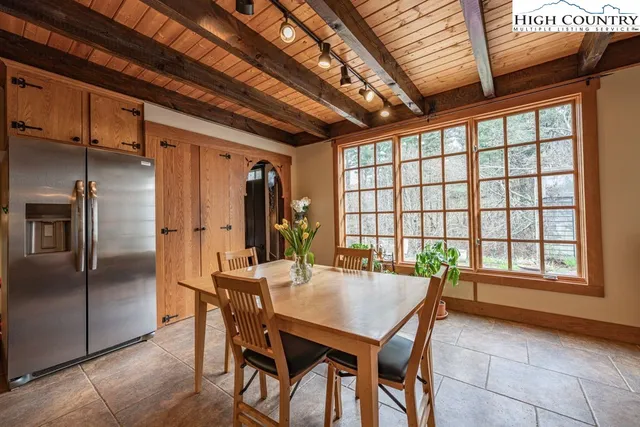 a living room with furniture a fireplace and a wooden floor