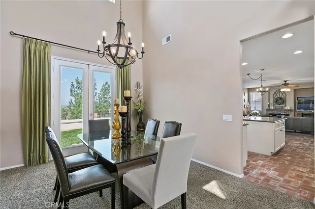 a kitchen with stainless steel appliances granite countertop a refrigerator sink and cabinets