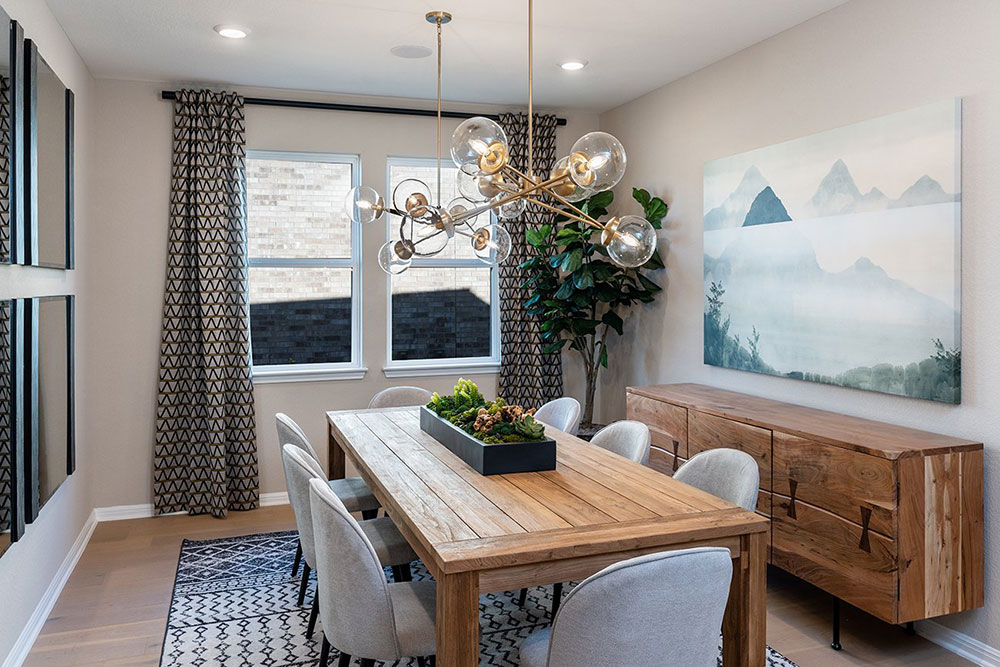 1212 Scenic Grn Loop Georgetown, TX 78628 - Photo 26 of 36 a dining room with furniture and a chandelier