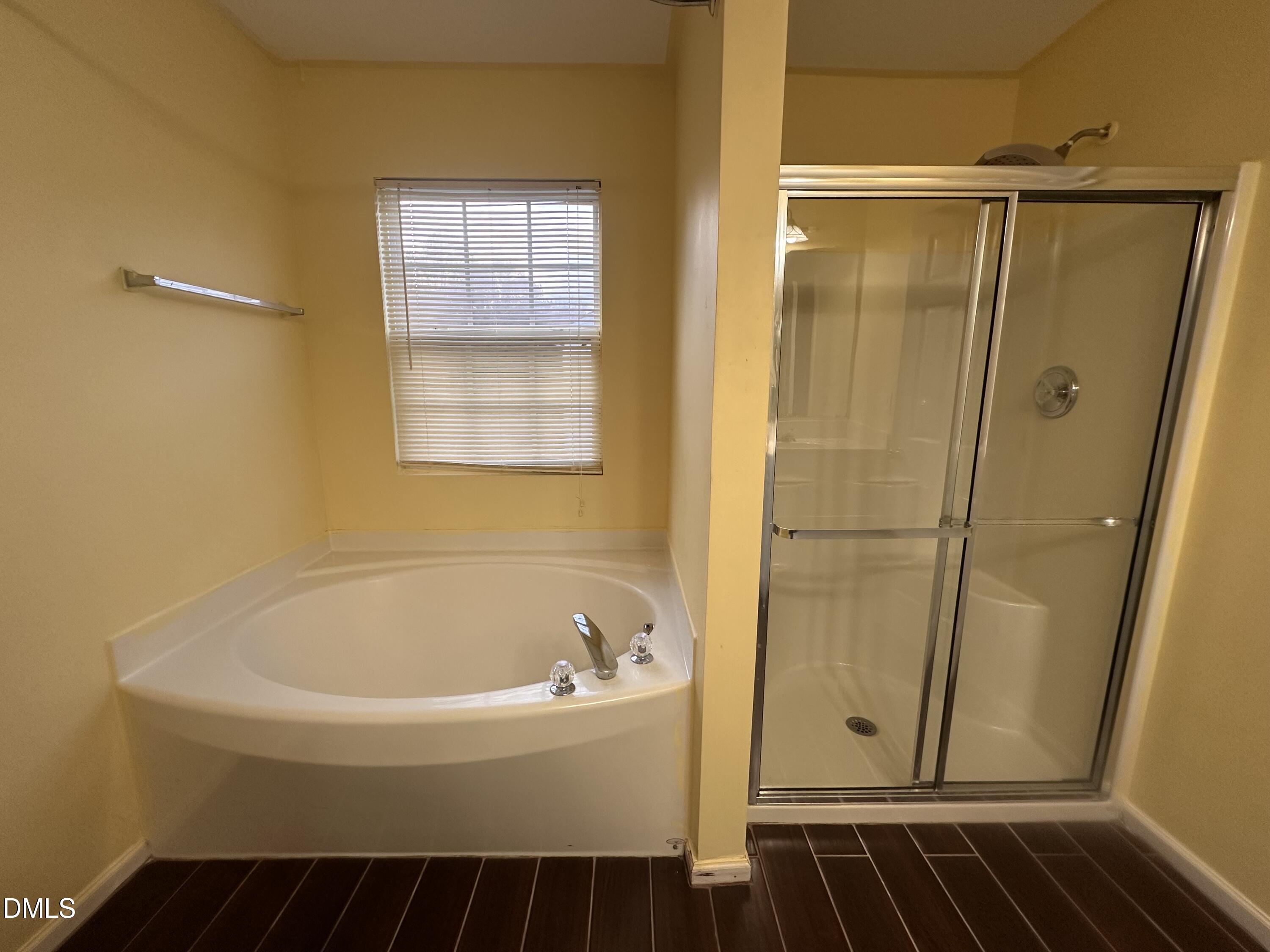 1220 Arbor Greene Drive Garner, NC 27529 - Photo 11 of 17 a bathroom with a bathtub and shower