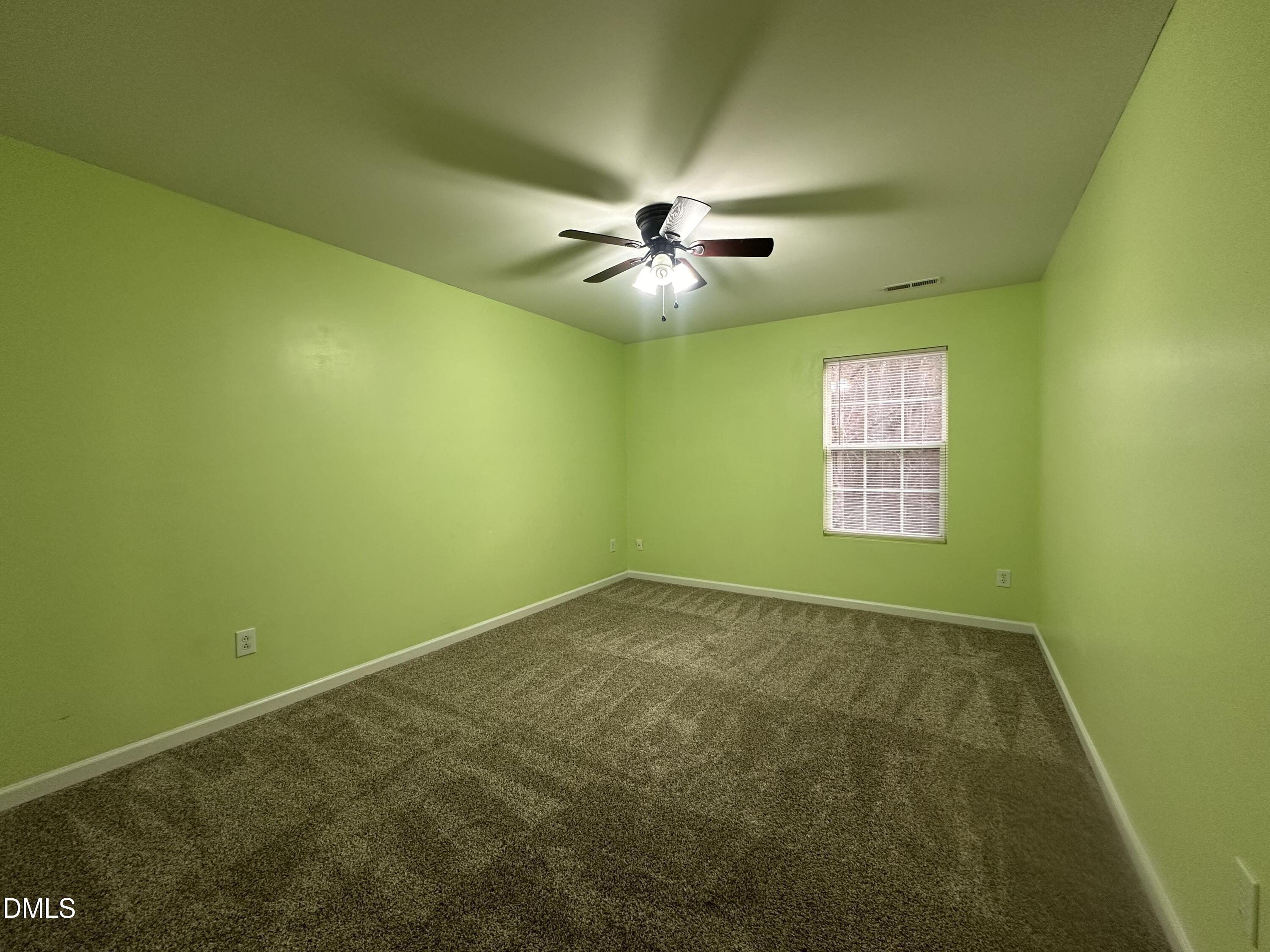 1220 Arbor Greene Drive Garner, NC 27529 - Photo 14 of 17 a view of an empty room and chandelier fan