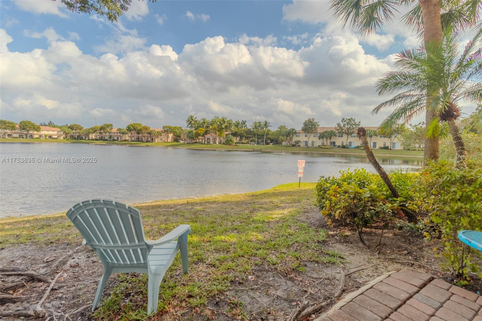 2695 Southwest 84th Terrace, Unit 104 Miramar, FL 33025 - Photo 20 of 36 a view of a lake with a garden