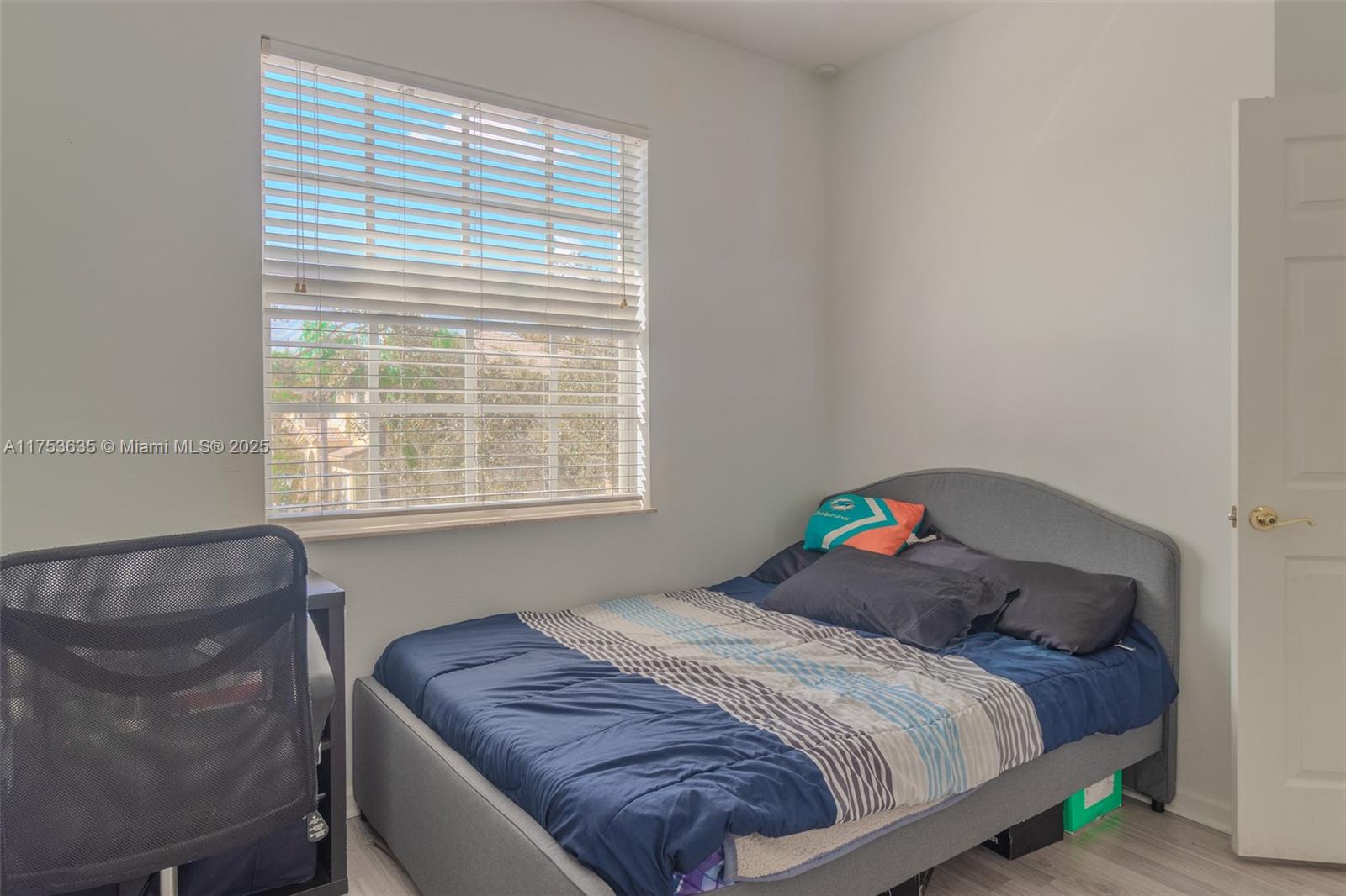 2695 Southwest 84th Terrace, Unit 104 Miramar, FL 33025 - Photo 23 of 36 a bedroom with a bed and a window