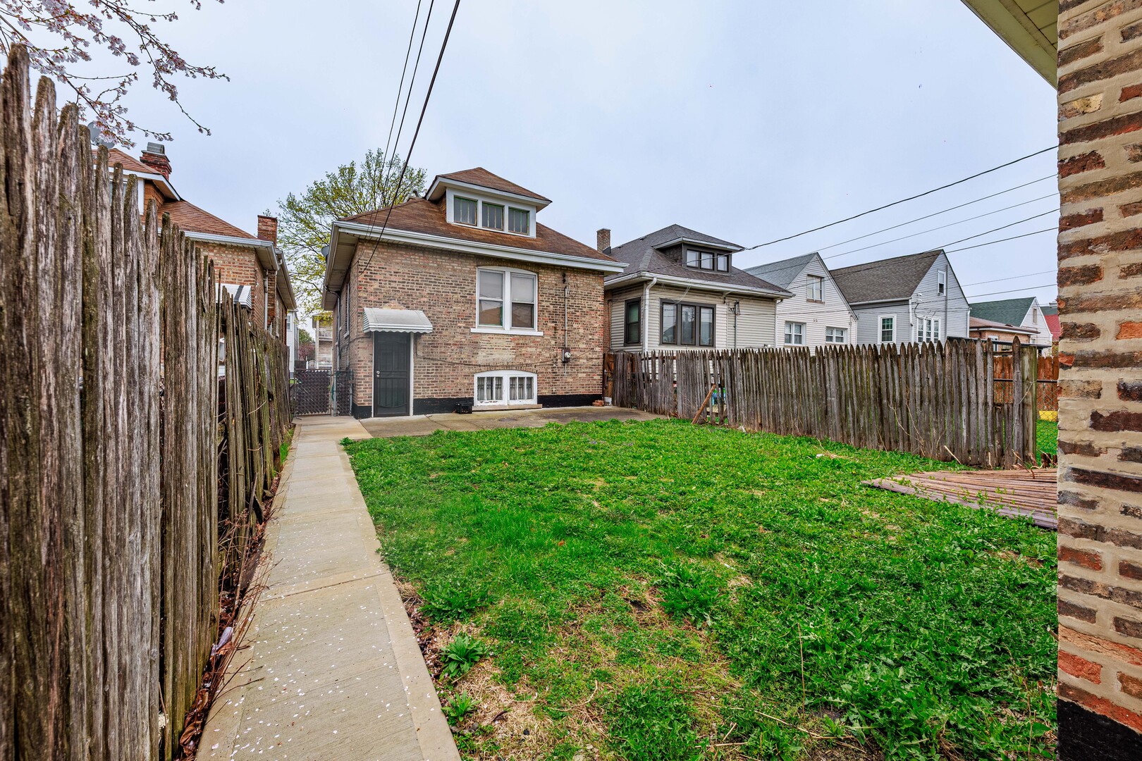 4941 South Kolin Avenue Chicago, IL 60632 - Photo 16 of 17 a front view of a house with yard and green space