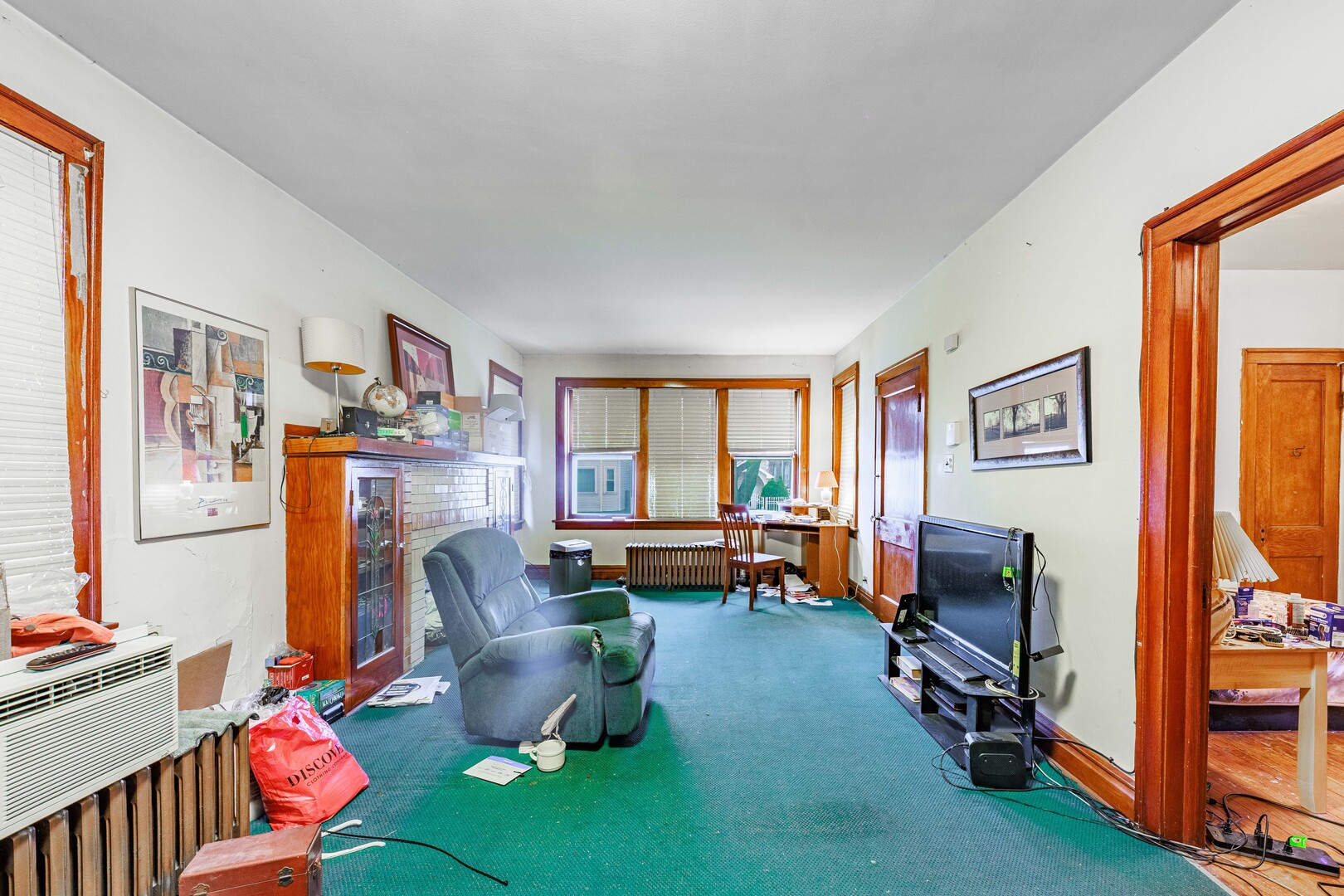 4941 South Kolin Avenue Chicago, IL 60632 - Photo 4 of 17 a living room with furniture a flat screen tv and a window