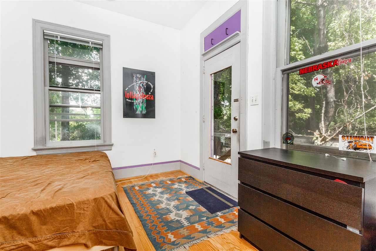 2200 Hope Street Raleigh, NC 27607 - Photo 13 of 25 a bedroom with a bed and a large window with outer view