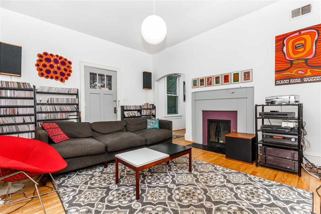 2200 Hope Street Raleigh, NC 27607 - Photo 3 of 25 a living room with furniture a rug and a fireplace