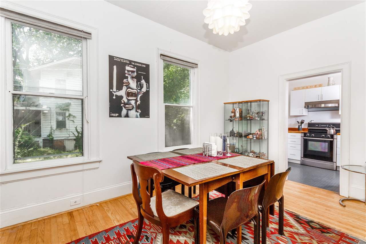 2200 Hope Street Raleigh, NC 27607 - Photo 6 of 25 a view of a dining room with furniture window and wooden floor