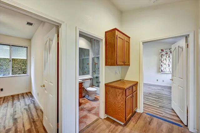 a view of hallway with wooden floor