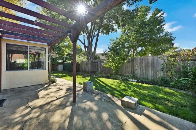 a view of a backyard with sitting area