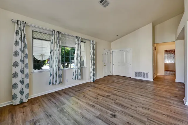 a view of a livingroom with wooden floor