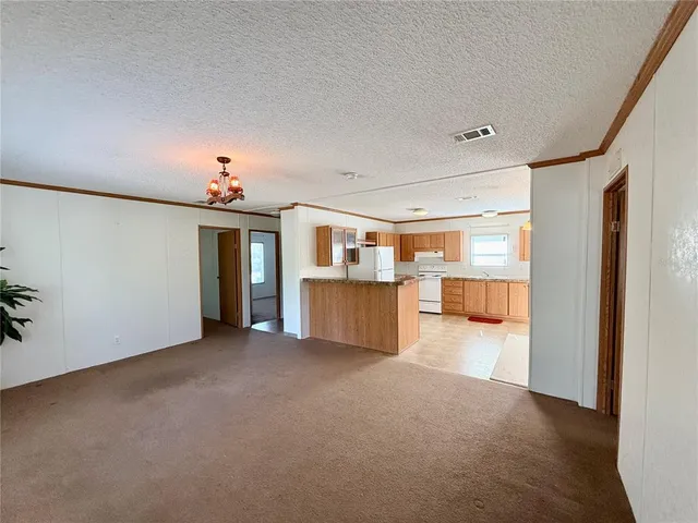 a kitchen that has a lot of cabinets in it