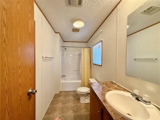 a view of yard along with trees