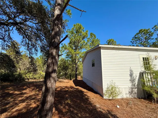a view of a house with a tree