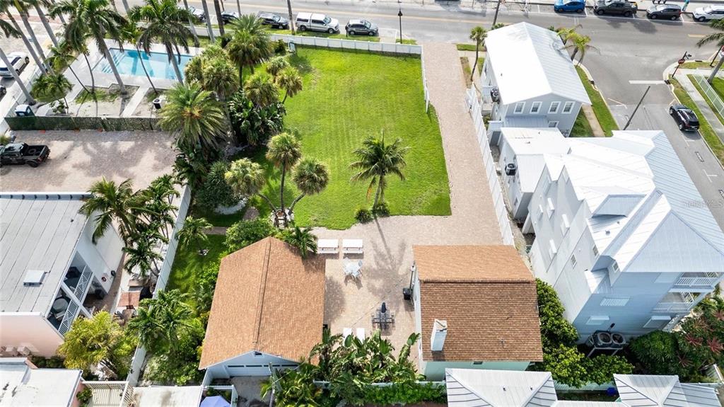 702 Pass A Grille Way St. Pete Beach, FL 33706 - Photo 7 of 41 an aerial view of a house with a garden and swimming pool