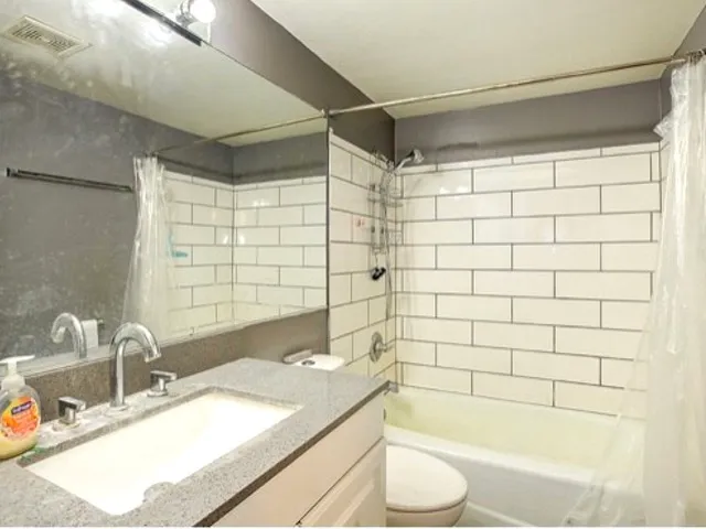 a bathroom with a sink and a bathtub