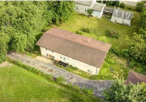 an aerial view of residential house with outdoor space